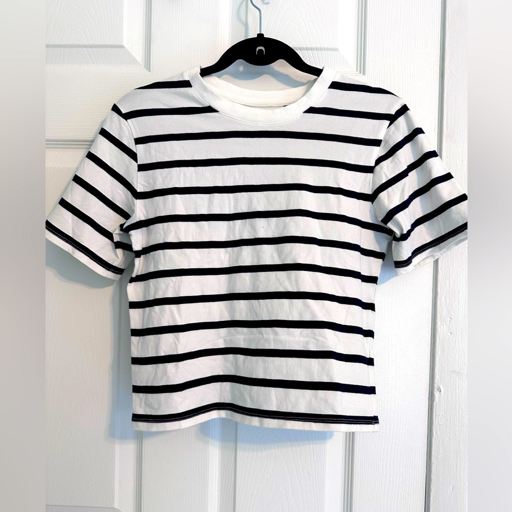 White top with black stripes